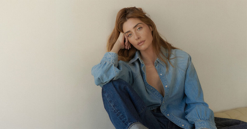 Model wearing light blue denim pieces from The Wellness Edit collection focused on comfort and ease.